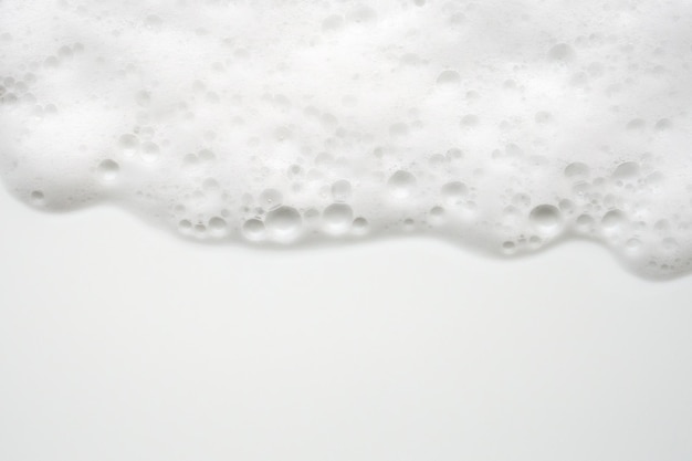 Foto struttura astratta delle bolle di schiuma di sapone bianco su sfondo bianco