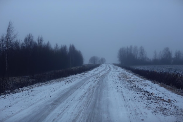 abstract winter road fog snow, landscape view in november transport