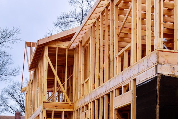 Photo abstract of wood home framing at construction site.