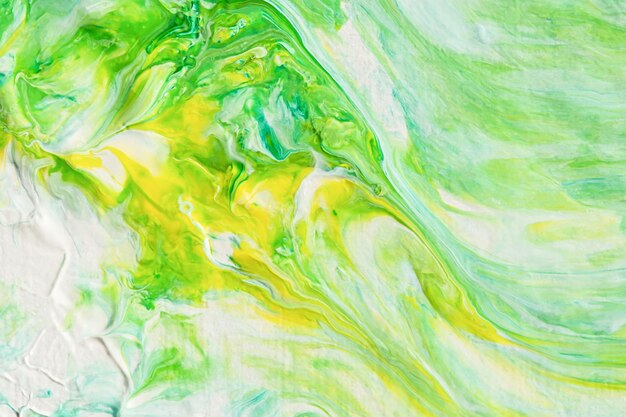 Abstract yellowgreen acrylic background Handdrawn painting with liquid acrylic