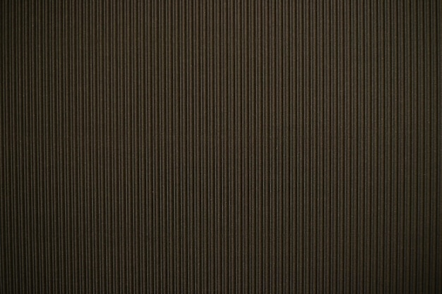 Abstracte achtergrond gemaakt van golfpapier voor zwarte applicatie Ruimte voor tekst Textuur Verticale strepen