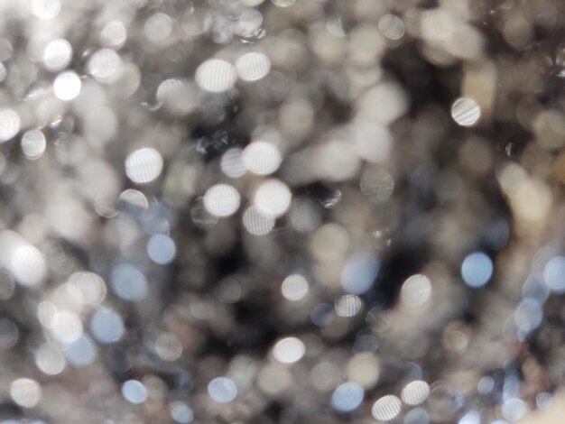 Foto abstracte achtergrond van metallic wazig oppervlak met bokeh vlekken