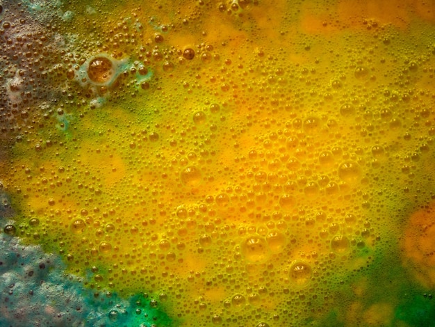 Foto abstracte achtergrond van veelkleurige borrelende vloeistof
