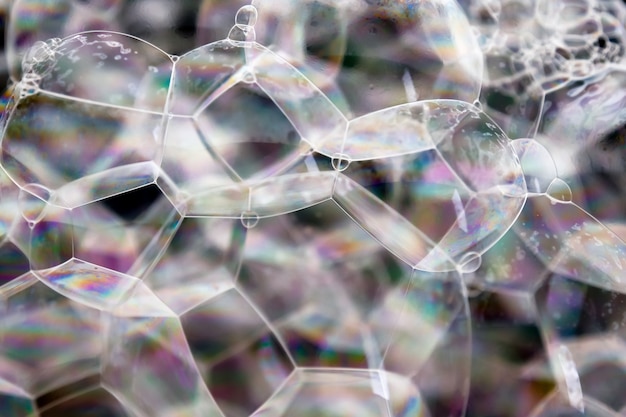 Foto abstracte achtergrond witte zeepachtige schuimtextuur. shampooschuim met bubbels
