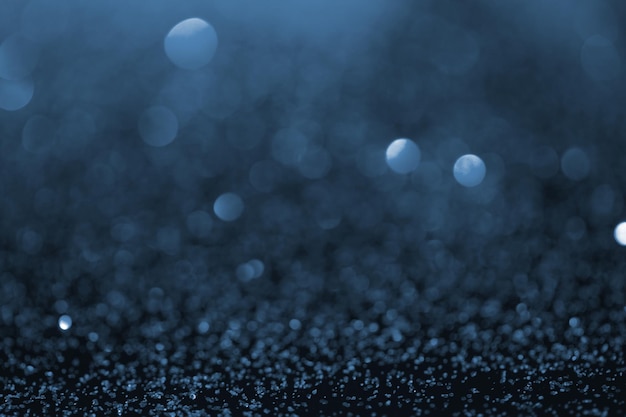 Foto abstracte blauwe glitter met bokeh op de achtergrond