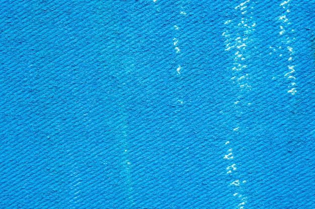 Abstracte blauwe waterverfverf op de achtergrond van de canvastextuur