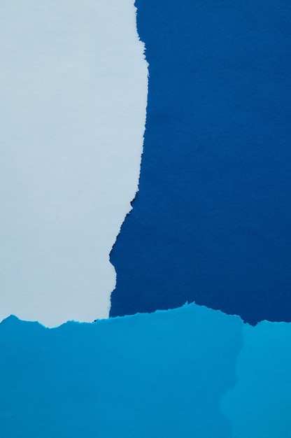 Abstracte blauwgekleurde achtergrond van gescheurd papier