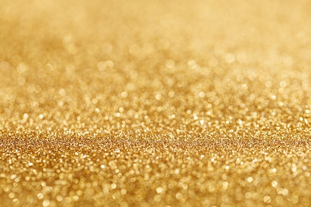 Abstracte bokeh-achtergrond met glanzende gouden glitter