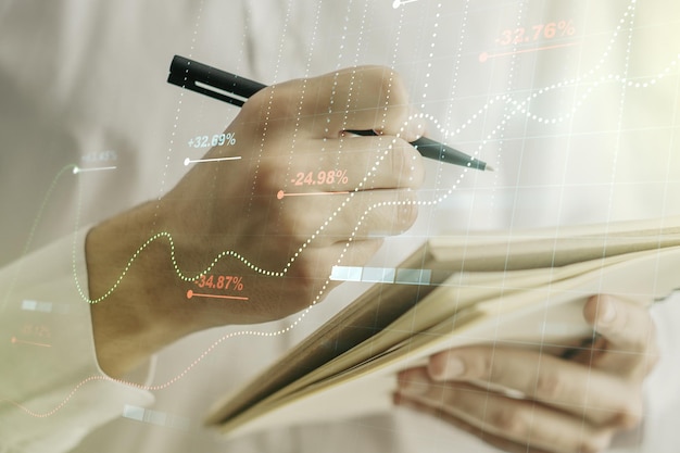 Abstracte creatieve stats data concept met man hand schrijven in notitieblok op achtergrond Multiexposure