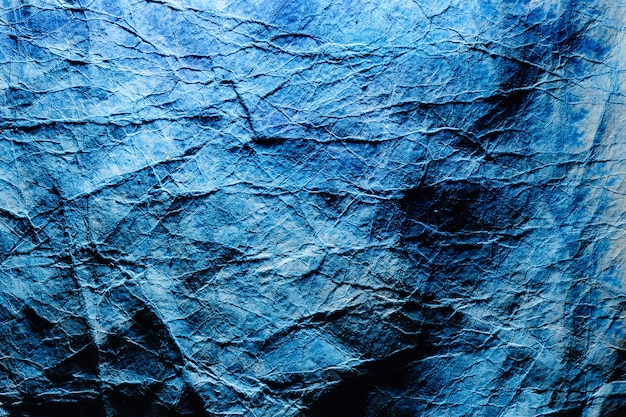 Abstracte fantoom blauwe wallpaper achtergrond. Verfrommeld papier textuur, diepe oceaan kleur