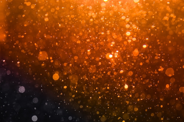 Abstracte gouden bokeh met zwarte achtergrond