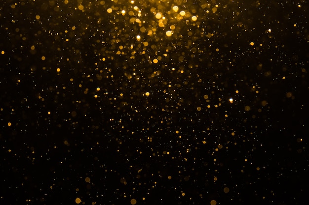 Abstracte gouden bokeh met zwarte achtergrond