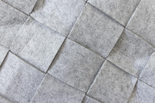 Abstracte grijze vilt textuur achtergrond Vierkant patroon Thuis opbergmand close-up