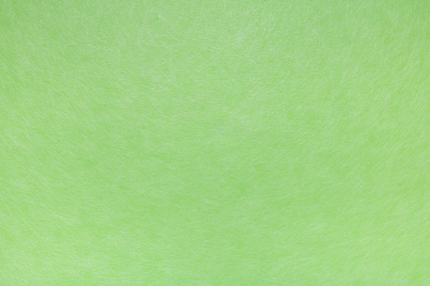 Abstracte groene achtergrond bedekt met spinnenwebben van witte vezels
