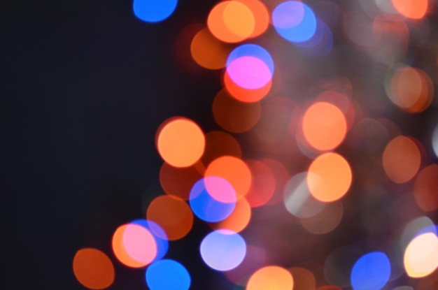 Foto abstracte intreepupil licht op zwarte achtergrond glinsterende bokeh sterren glitter vintage lichten achtergrond