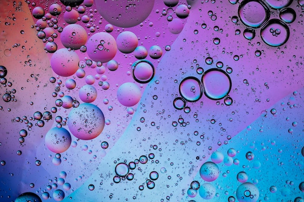 Abstracte kleurrijke creatieve macro olie en water achtergrond met bubbels