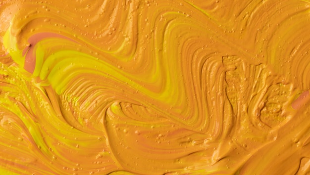 Foto abstracte oranje en gele olieverf penseelstreken