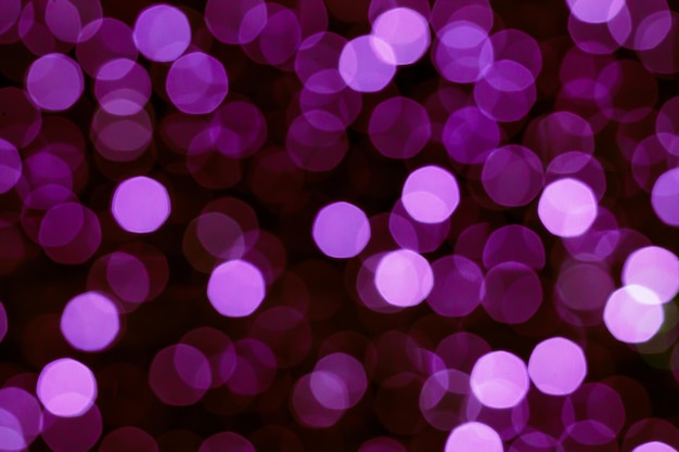 Abstracte paarse violet kerst bokeh lichten achtergrond