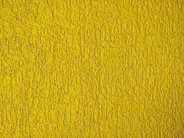 Foto abstracte ruwe muur textuur gips geel gouden kleur