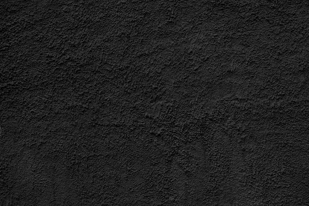 Abstracte ruwe zwarte textuur gepleisterde bouwmuur