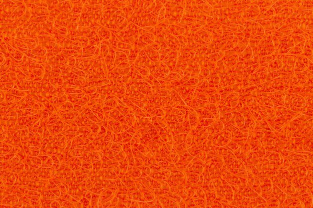 Abstracte textuur van de oranje oppervlaktewashandjes voor het macroclose-up van afwas