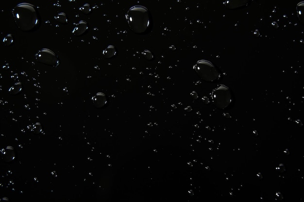 Abstracte waterdruppels op zwarte achtergrond macro Bubbels close-up