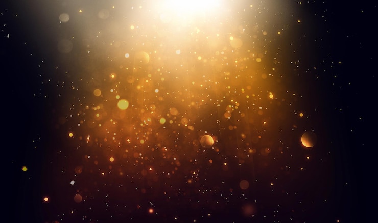 Foto abstracte zwarte achtergrond met gouden vlekken lichtflits