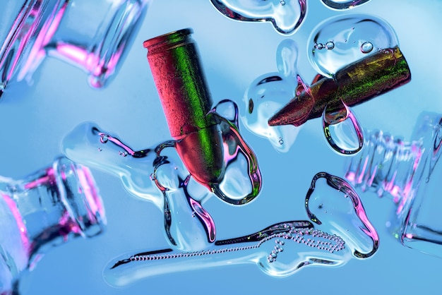 Abstraction on cosmetics, drops, air bubbles, bullets and bottles in neon