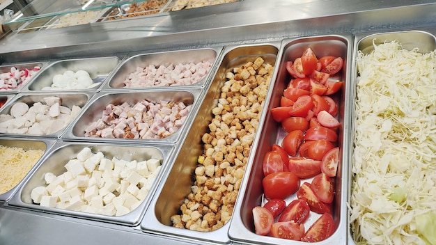 An abundant buffet featuring a variety of foods such as tomatoes and cheese