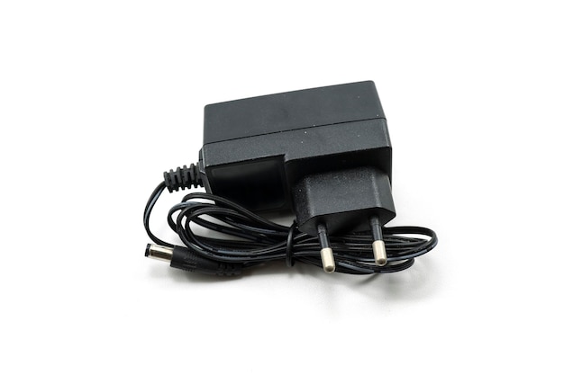 Photo ac dc adapter black charger isolated on white