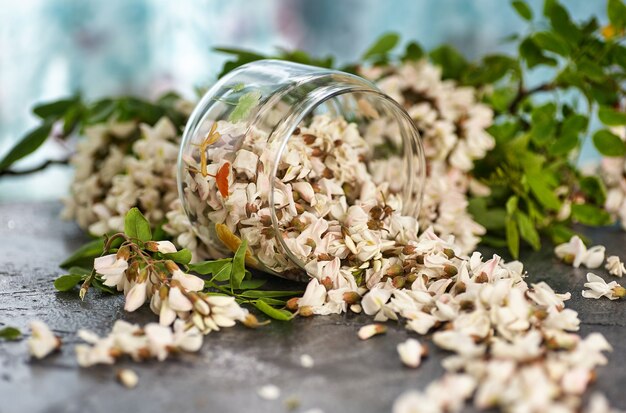 Acacia flowers in glass bowl on a table