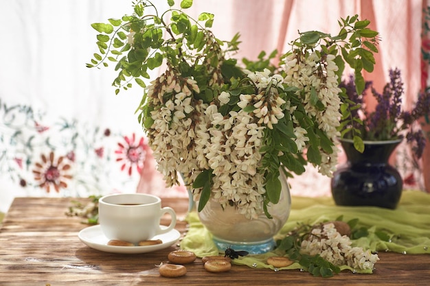 Acacia flowers in white vase