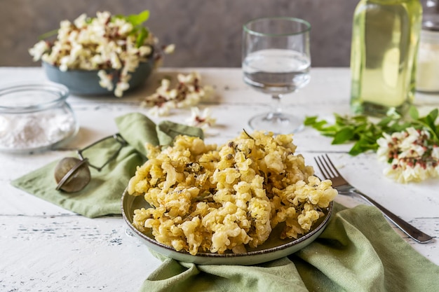 Acacia fried flowers or batter fries Gathering and edible flowers concept