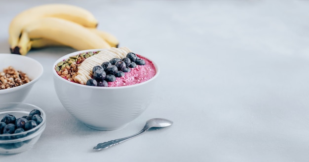 Acai bowl of smoothies with blueberries and banana 