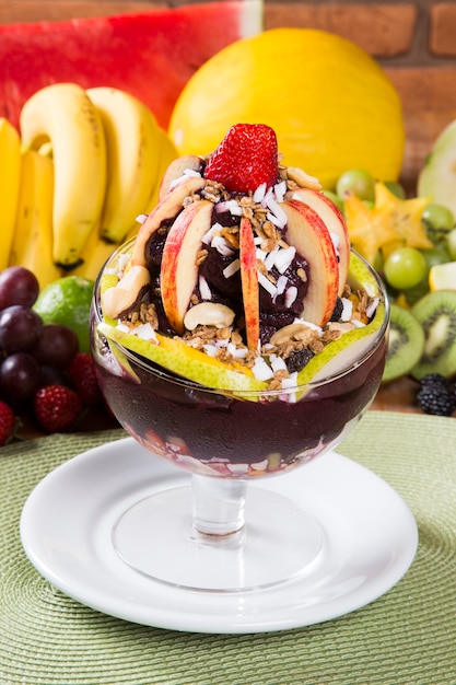 Acai bowl with ice cream, fruit and cereal