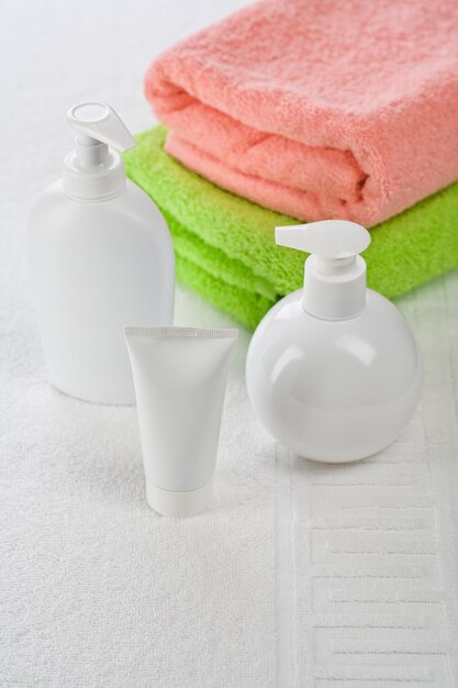 Accessories for bathing on white towel