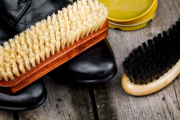 Accessories for the care and cleaning of shoes on a wooden table