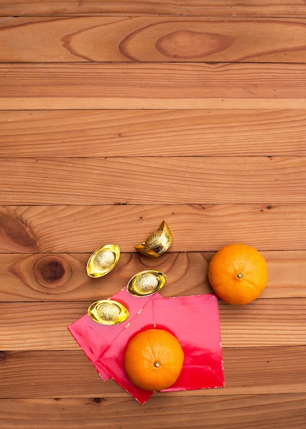 Accessories on Lunar New Year & Chinese New Year vacation concept.Orange in white plate with red pocket money