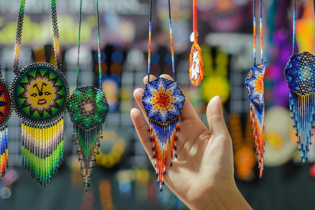 Accessories made with multicolored chaquira. Mexican handicrafts made with colorful stones.