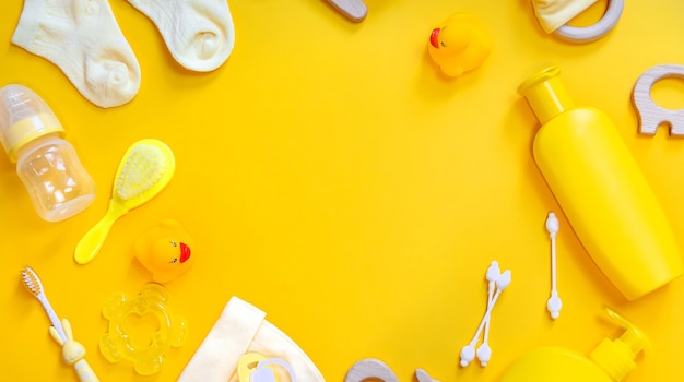 Accessories for newborns on a yellow background