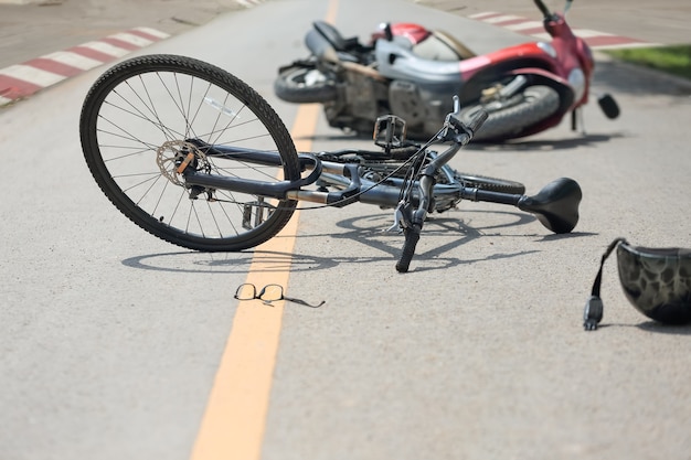 Accident motorcycle crash with bicycle on road