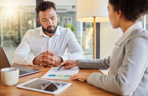 Photo accountant consulting an entrepreneur about company financial performance in an office using statistics finance advisor in a meeting having a business growth strategy discussion with businessman