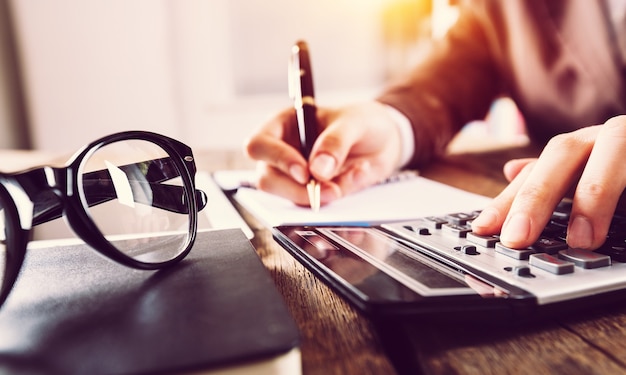 Accountant man with calculator and documents