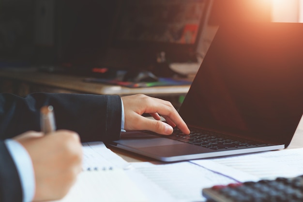 accountant using laptop in office