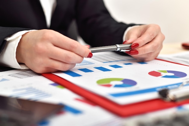 Accountant woman holding pen