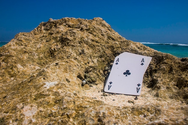 Photo ace of club poker card beach theme