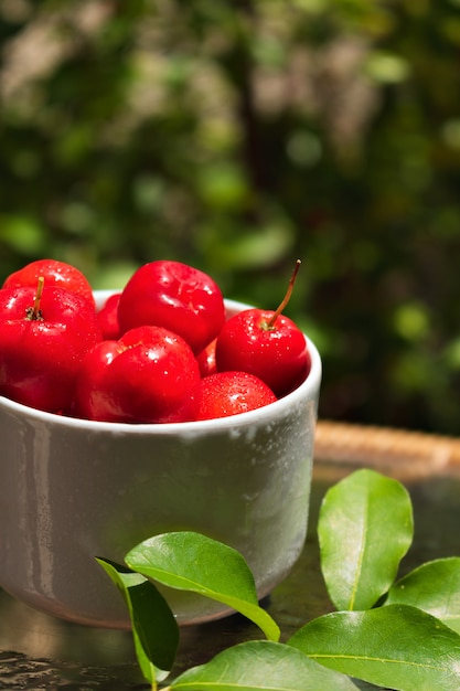 Acerola fruit in a bowl at the garden