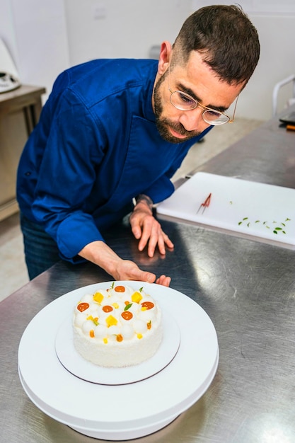 Achieving Perfection Pastry Chef Inspecting His Masterpiece with Meticulous Attention to Detail