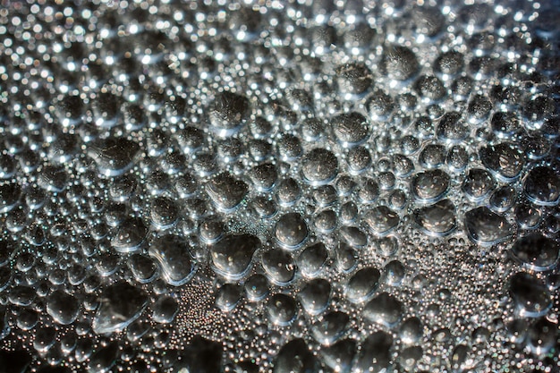 Achtergrond bedekt met waterdruppels in close-up weergave