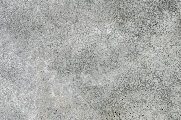 Achtergrond betonnen muur met strepen en scheuren grijze abstracte achtergrond